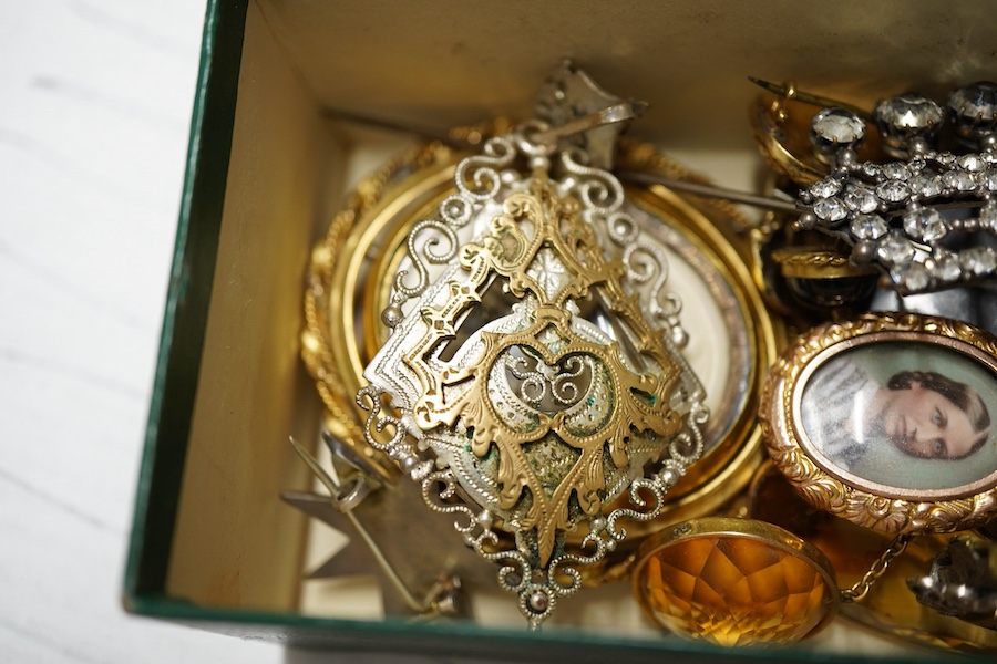 Six assorted 19th century mourning brooches including William IV yellow metal with plaited hair date 1834 and George III with split pearl and hair, largest with carved wax? panel depicting deer, 56mm, a Murrle Bennet & C